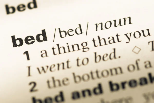 Close up of old English dictionary page with word bed — Stock Photo, Image