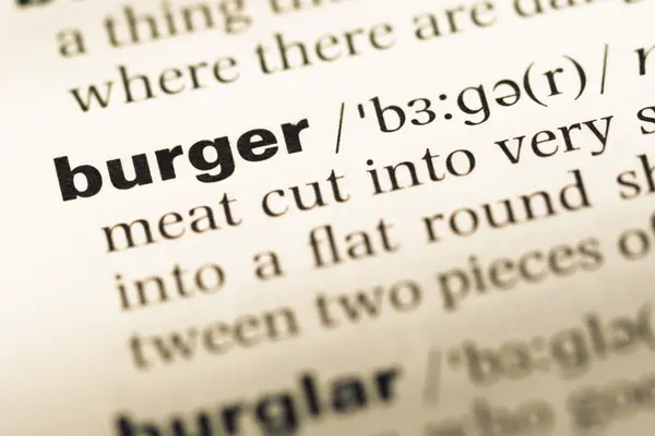 단어 햄버거와 함께 오래 된 영어 사전 페이지 닫습니다 — 스톡 사진