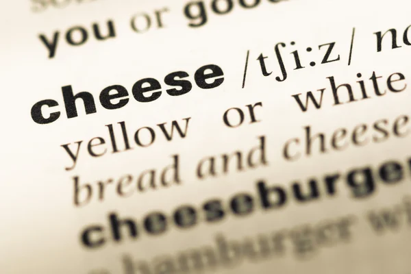 단어 치즈와 함께 오래 된 영어 사전 페이지 닫습니다 — 스톡 사진