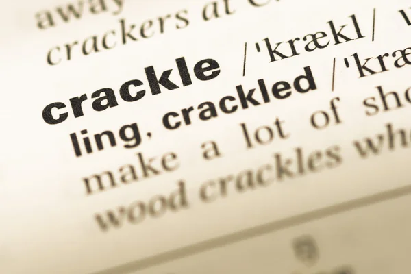 Close up of old English dictionary page with word crackle — Stock Photo, Image