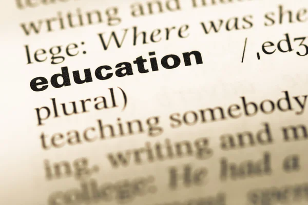 Close up of old English dictionary page with word education — Stock Photo, Image