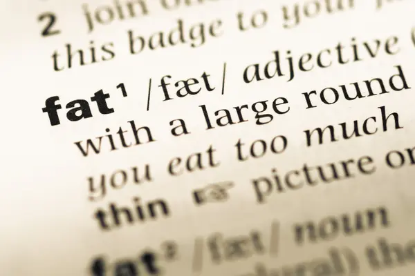 Close up of old English dictionary page with word fat — Stock Photo, Image