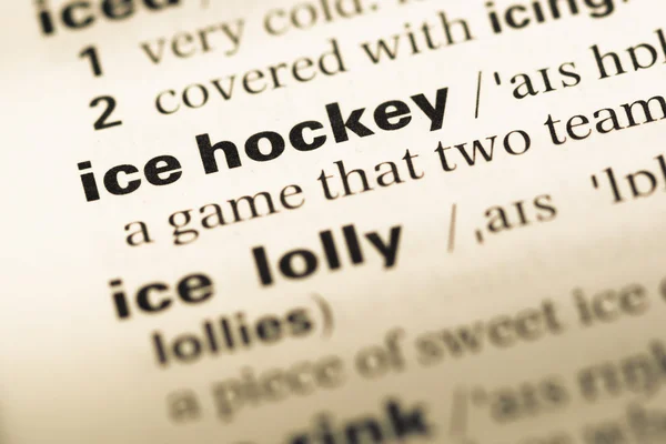 Close up of old English dictionary page with word ice hockey — Stock Photo, Image