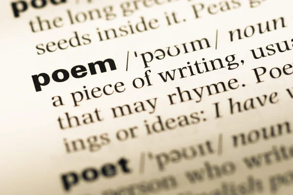 Close up of old English dictionary page with word poem Royalty Free Stock Photos