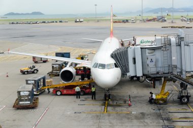 HONG KONG - MAY 16: Cargoes being unloaded from a Hong Kong Airlines at Hong Kong airport on May 16, 2014 in Hong Kong. Aside from China Airlines, Hong Kong Airlines is one of the most busy carriers in the region.