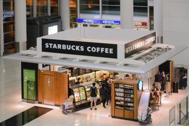 HONG KONG- APRIL 8: Starbucks Coffee coffeehouse on April 8, 2014 in Hong Kong. Starbucks is the largest coffeehouse company in the world, with 19,435 stores in 58 countries (2012).