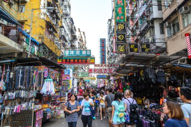 HONG KONG - MAY 24: Crowded market stalls in old district on March 24, 2013 in Hong Kong. With land mass of 1104 km and 7 million people, Hong Kong is one of most densely populated areas in the world.