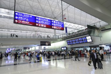 HONG KONG, CHINA - FEBRUARY 11: Passengers in the airport main lobby on February 11, 2013 in Hong Kong, China. The Hong Kong airport handles more than 70 million passengers per year.