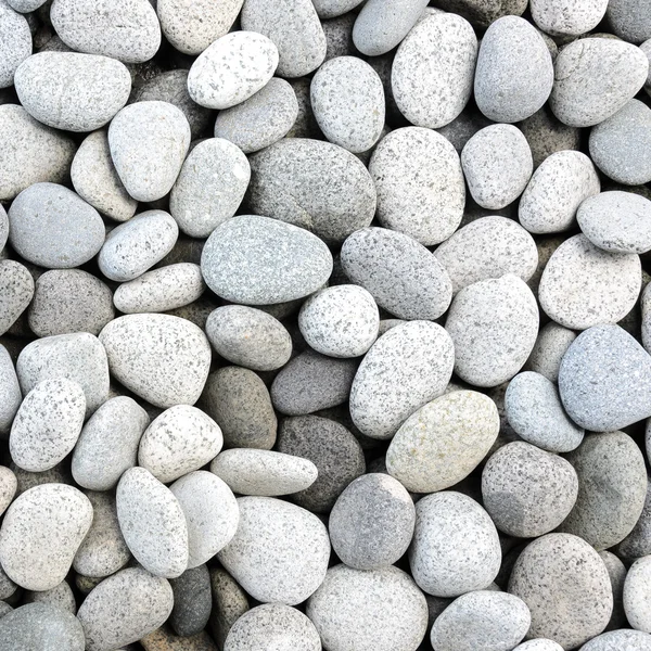 Fondo de guijarros de roca blanca pulida naturalmente — Foto de Stock