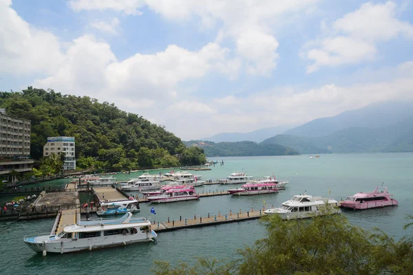 SUN MOON LAKE - JULY 15: many boats parking at the pier on July 15, 2014 at Sun Moon Lake, Taiwan. Sun Moon Lake is the largest body of water in Taiwan as well as a tourist attraction.