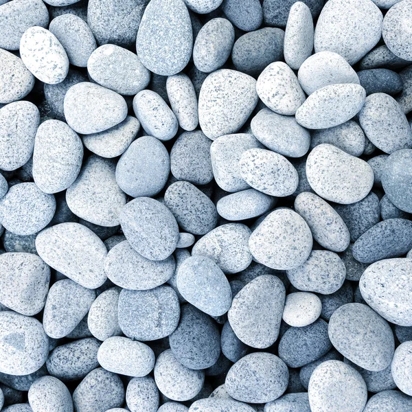 Naturally polished white rock pebbles background — Stock Photo, Image