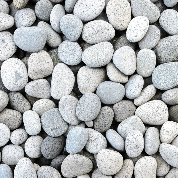 Naturligt polerad vit vaggar stenar bakgrund — Stockfoto