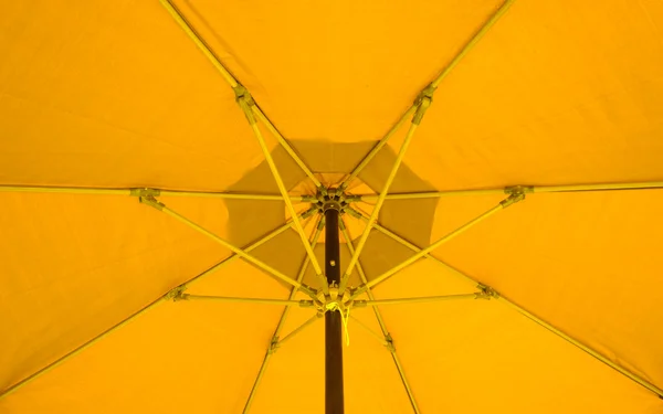 Yellow Patio Umbrella Background Stock Photo