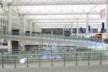 HONG KONG, CHINA - FEBRUARY 11: Passengers in the airport main lobby on February 11, 2013 in Hong Kong, China. The Hong Kong airport handles more than 70 million passengers per year.