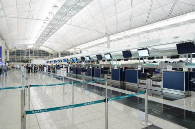 HONG KONG, CHINA - FEBRUARY 11: Passengers in the airport main lobby on February 11, 2013 in Hong Kong, China. The Hong Kong airport handles more than 70 million passengers per year.