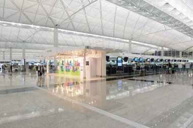 HONG KONG, CHINA - FEBRUARY 11: Passengers in the airport main lobby on February 11, 2013 in Hong Kong, China. The Hong Kong airport handles more than 70 million passengers per year.