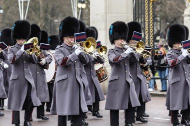 LONDON - APR 15: The changing of the guard ceremony at Buckingham Palace on April 15th, 2013 in London, UK. It is one of England's most popular visitor attractions.