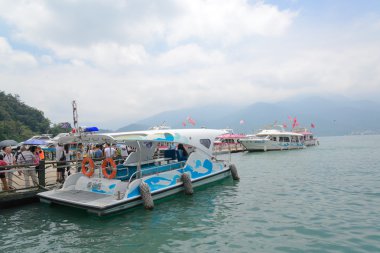 SUN MOON LAKE - JULY 15: many boats parking at the pier on July 15, 2014 at Sun Moon Lake, Taiwan. Sun Moon Lake is the largest body of water in Taiwan as well as a tourist attraction.
