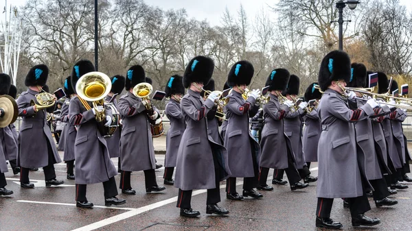 LONDON - APR 15: The changing of the guard ceremony at Buckingham Palace on April 15th, 2013 in London, UK. It is one of England's most popular visitor attractions.