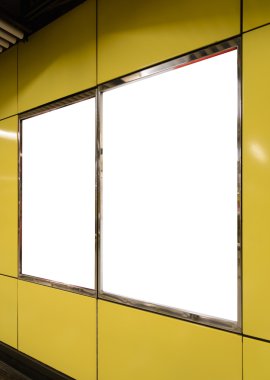 Two big vertical / portrait orientation blank billboard on yellow wall