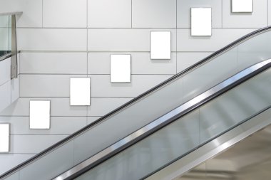 Five big vertical / portrait orientation blank billboard with escalator background