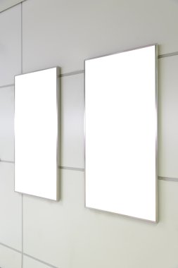 Two big vertical / portrait orientation blank billboard on white wall
