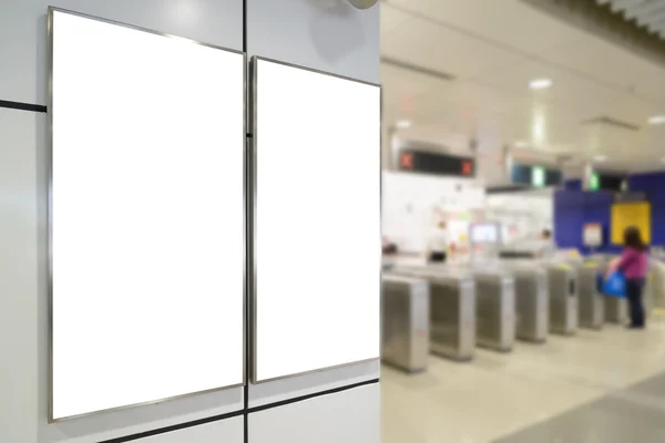 Two big vertical / portrait orientation blank billboard on wall in train station entrance — Stock Photo, Image