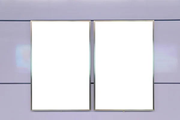 Two big vertical / portrait orientation blank billboard on purple wall — Stock fotografie