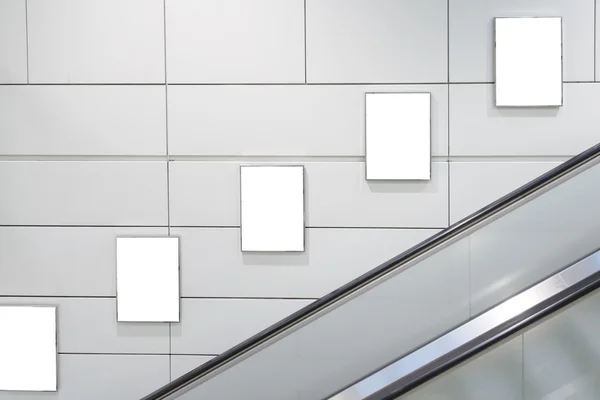 Five big vertical / portrait orientation blank billboard with escalator background