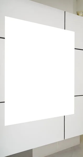 One big vertical / portrait orientation blank billboard on white wall — 图库照片