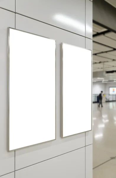 Two blank big vertical / portrait orientation billboard on modern white wall — 图库照片