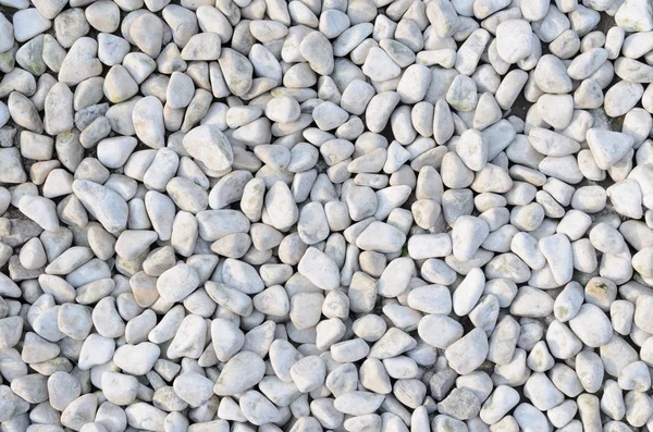 Naturally polished white rock pebbles background — Stock Photo, Image
