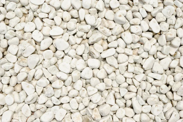 自然に研磨された小さな白い岩の小石の背景 — ストック写真