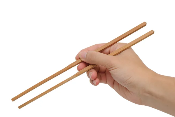 Sağ eli beyaz arka plan ile bambu çubuk kullanarak