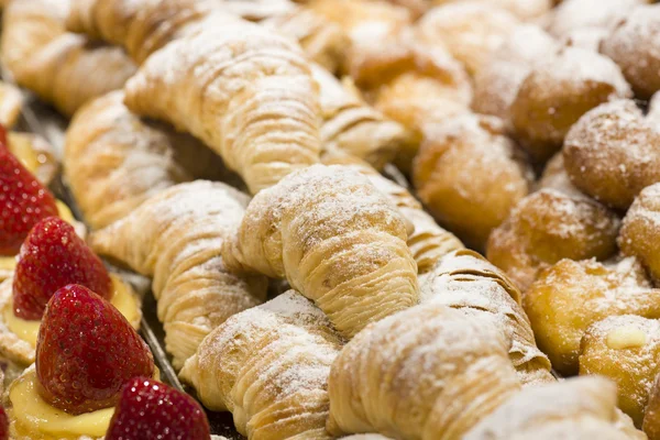 Sweet pastry covered with icing sugar — Stock Photo, Image