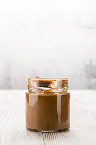 Chocolate Cream Glass Jar Wooden Table — Stock Photo, Image