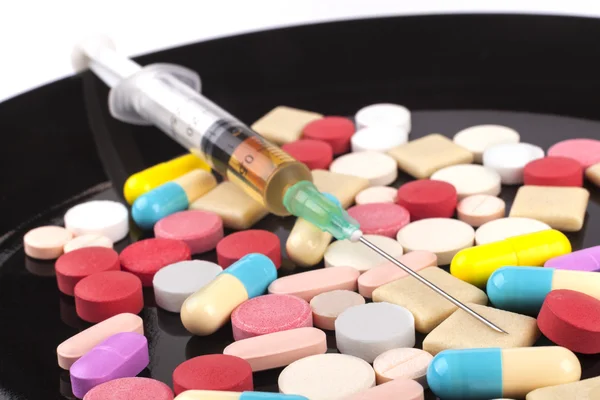 Syringe on Pills — Stock Photo, Image