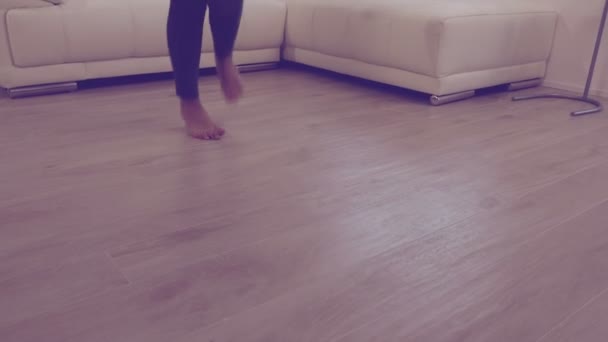 Camera moving from feet to closeup of Happy beautiful girl dancing at home 4K — Stock Video