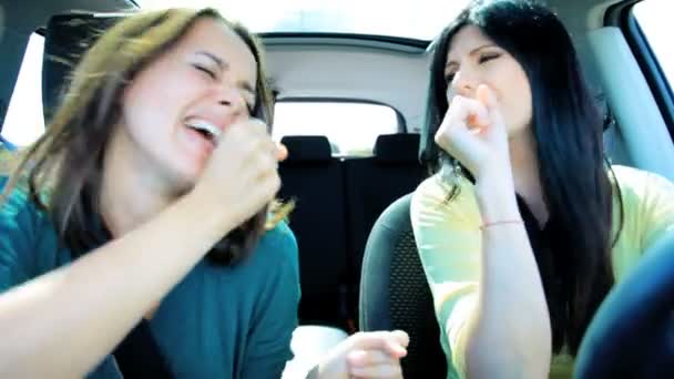 Women singing and driving car