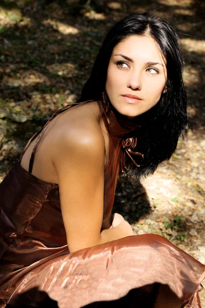 Sweet cute woman posing in forest with green eyes — Stock Photo, Image