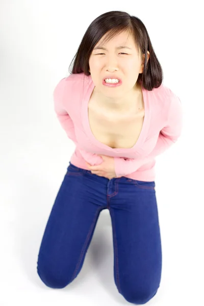 Asian woman with strong stomach ache — Stock Photo, Image