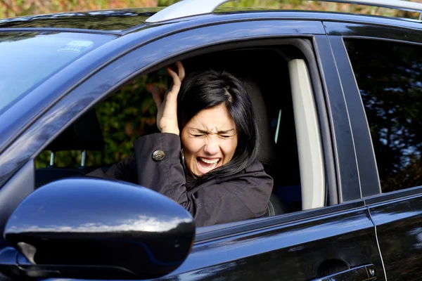 Woman in car shouting because of accident — Stock Photo, Image