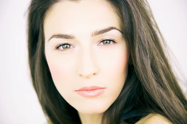 Closeup of woman with green eyes posing — Stock Photo, Image