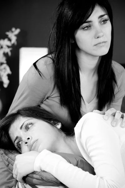 Two sisters deep sorrow caused by someone death — Stock Photo, Image