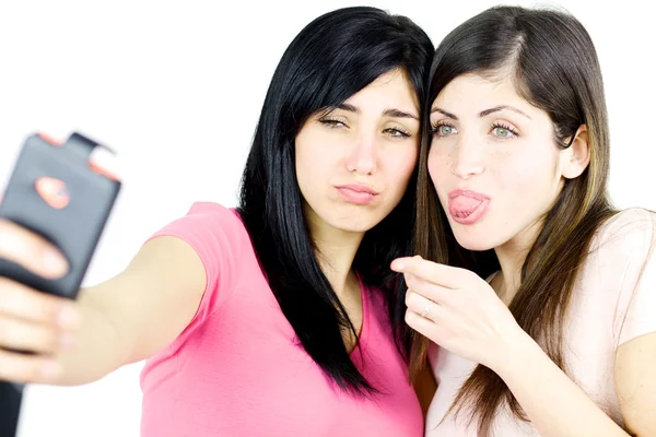 Chicas haciendo caras graciosas tomando selfie Fotos De Stock