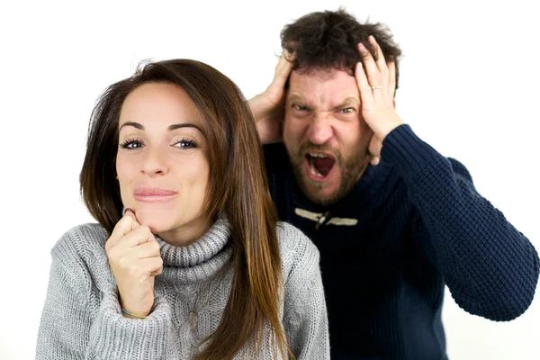 Man shouting while woman is laughing being naughty — Stock Photo, Image