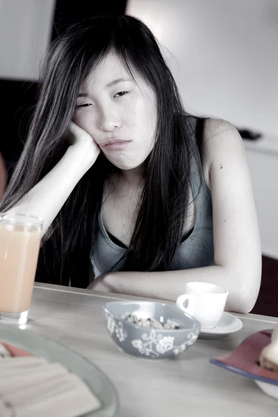 Sad chinese woman feeling sad about being on a diet — Stock Photo, Image