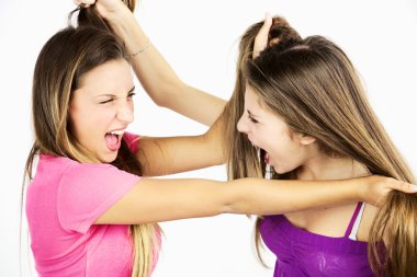 Two teenager friends fighting pulling long hair isolated clipart