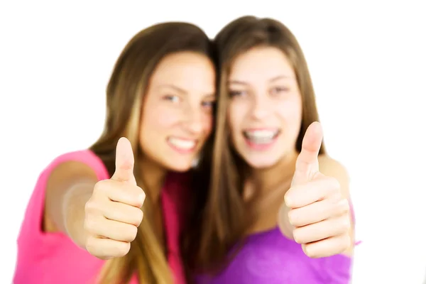 Two girls thumbs up in focus isolated — Stock Photo, Image