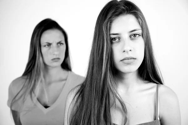 Unhappy angry teenager girlfriends black and white — Stock Photo, Image